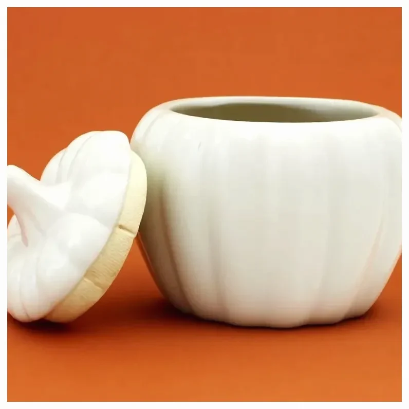 RECIPIENTE PARA VELA DE CERÁMICA CON FORMA DE CALABAZA